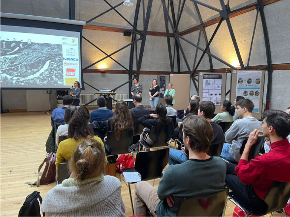 People seated and facing a screen during a BPM event